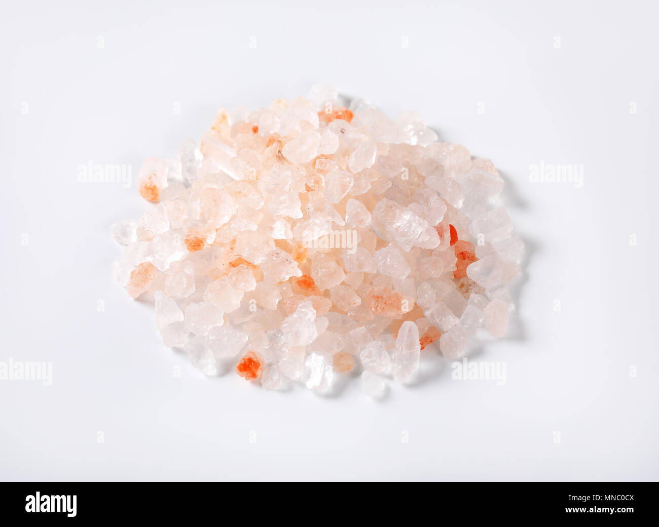 pile of coarse grained salt on white background Stock Photo