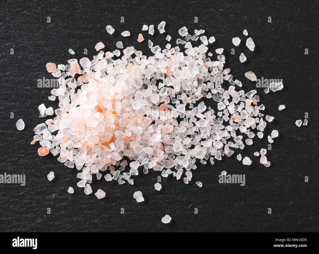 pile of coarse grained salt on black background Stock Photo