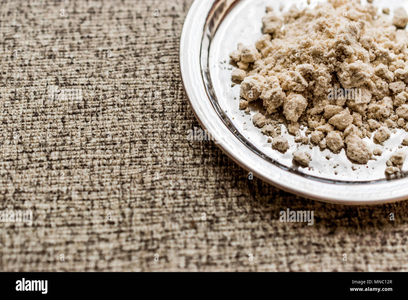 Mahlep, mahaleb or mahalep powder on silver plate. (Organic Concept.) Stock Photo