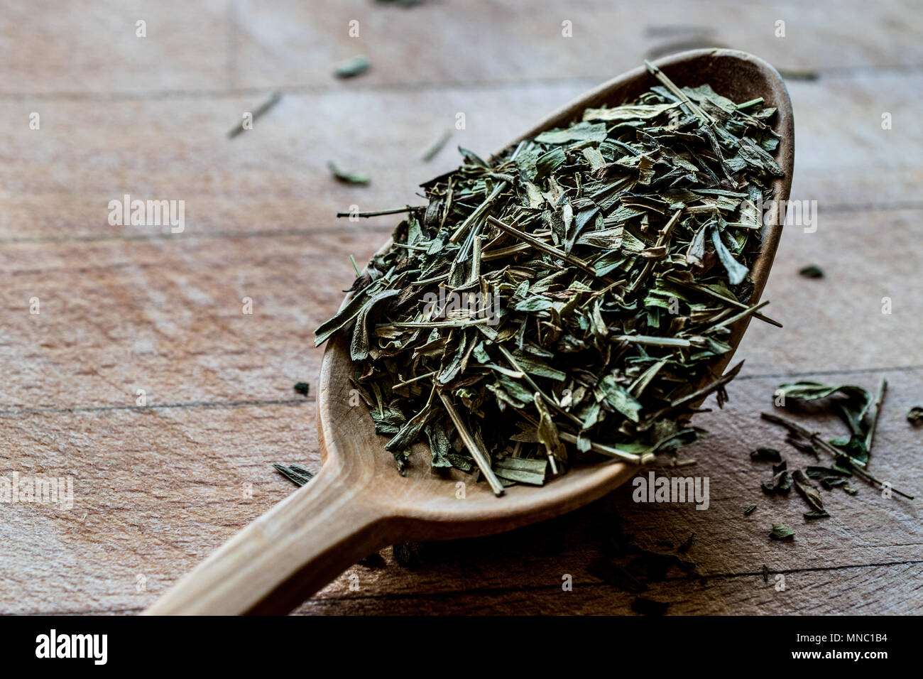Tarragon Spice in wooden spoon / Tarhun Otu. Organic food Stock Photo
