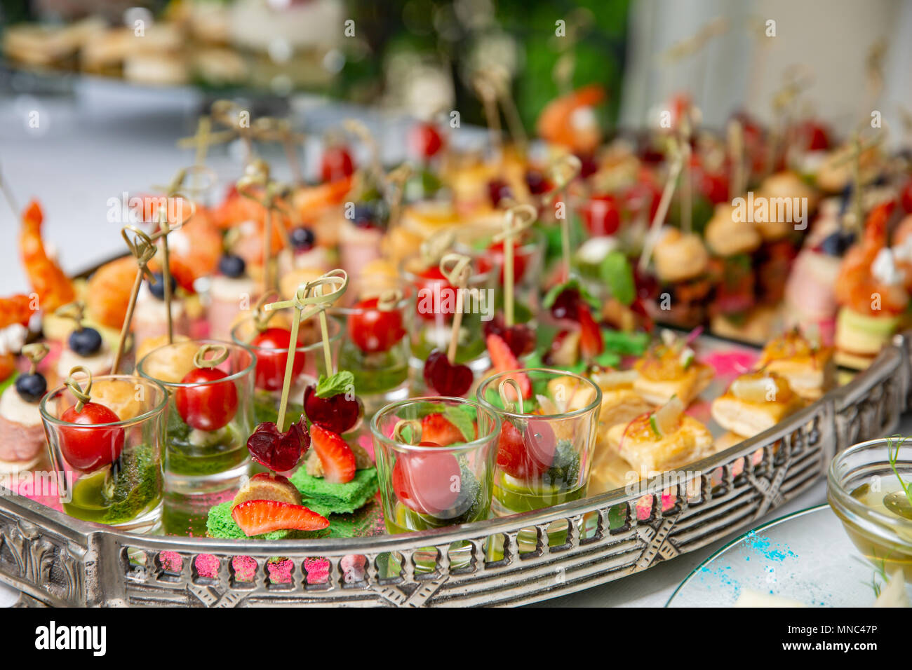 Light snacks, canap s with lard, cheese, meat, sauce, cherry tomatoes