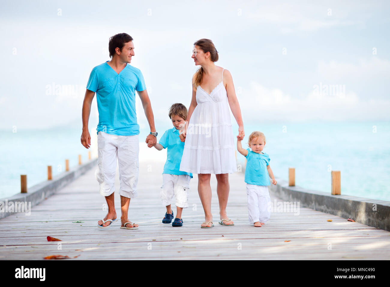 Family of four at the seashore hi-res stock photography and images - Alamy
