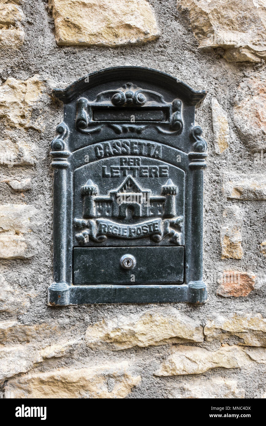 A mailbox on the wall of a house in a village in the French part of the Pyrenees Stock Photo