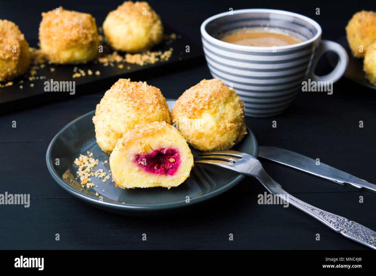 Breadcrumb dumplings served with a cup of coffee Stock Photo Alamy