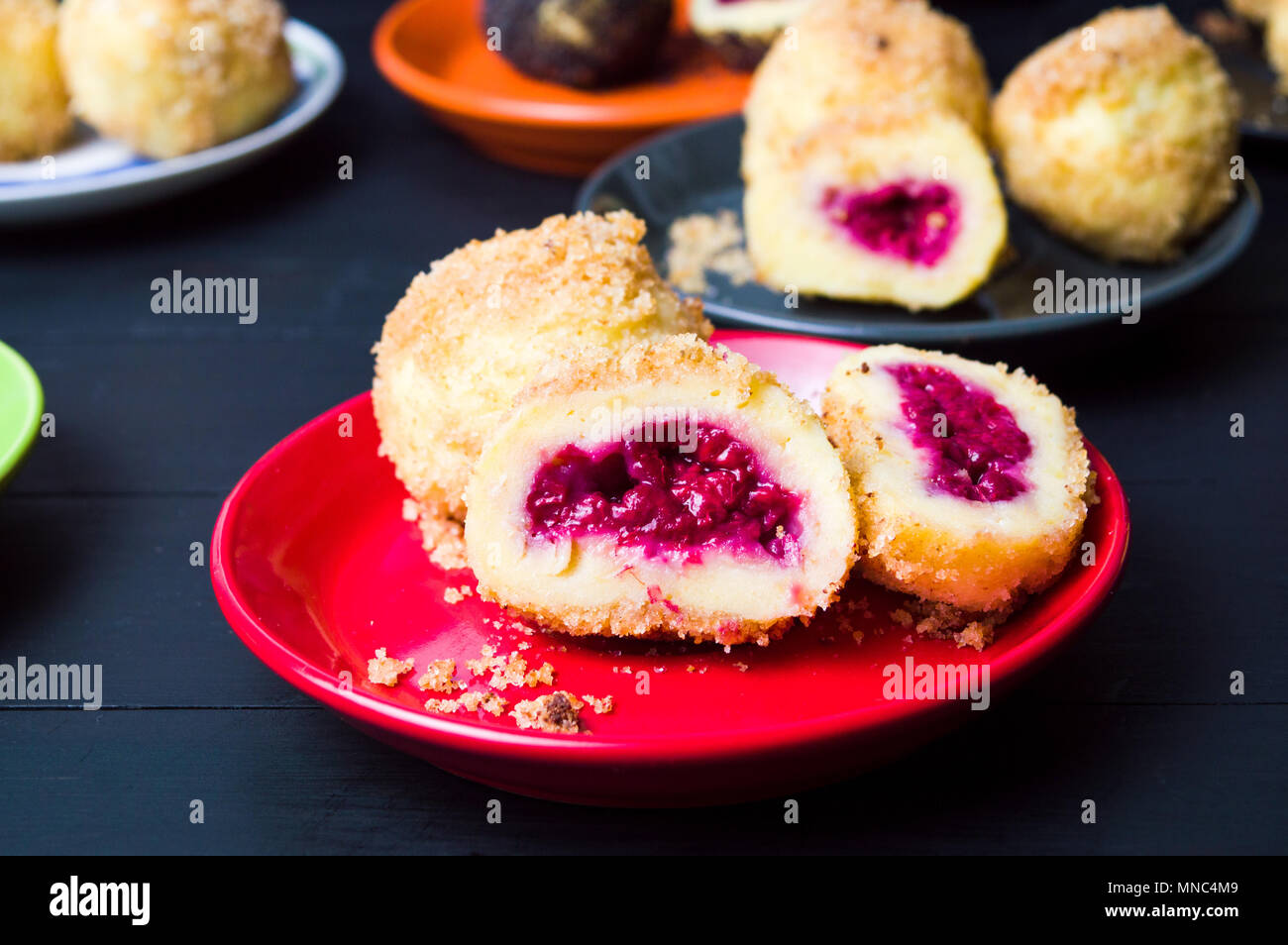 Homemade breadcrumb dumplings with cherry fruit topping Stock Photo Alamy