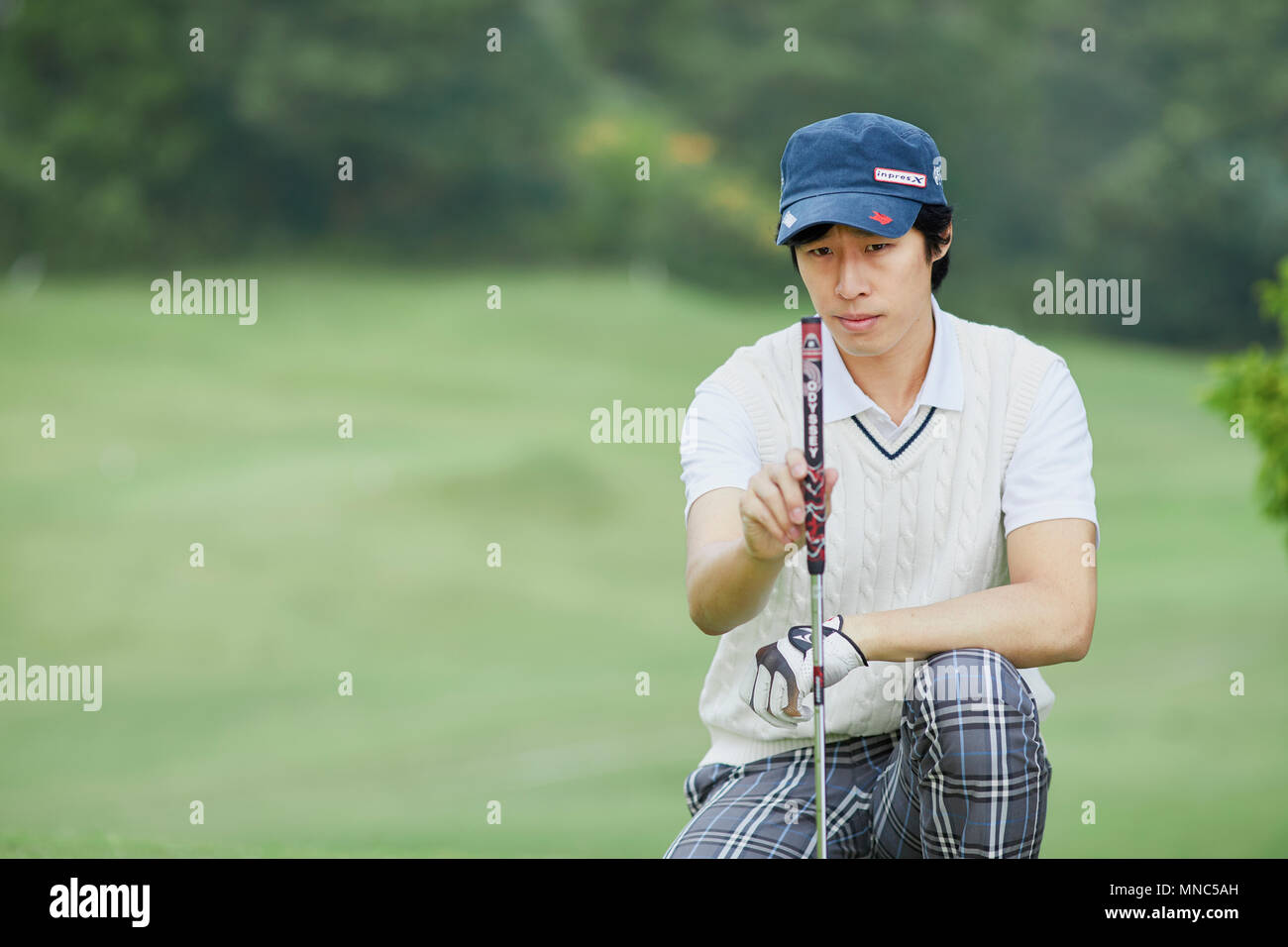 Japanese golf player on course Stock Photo Alamy