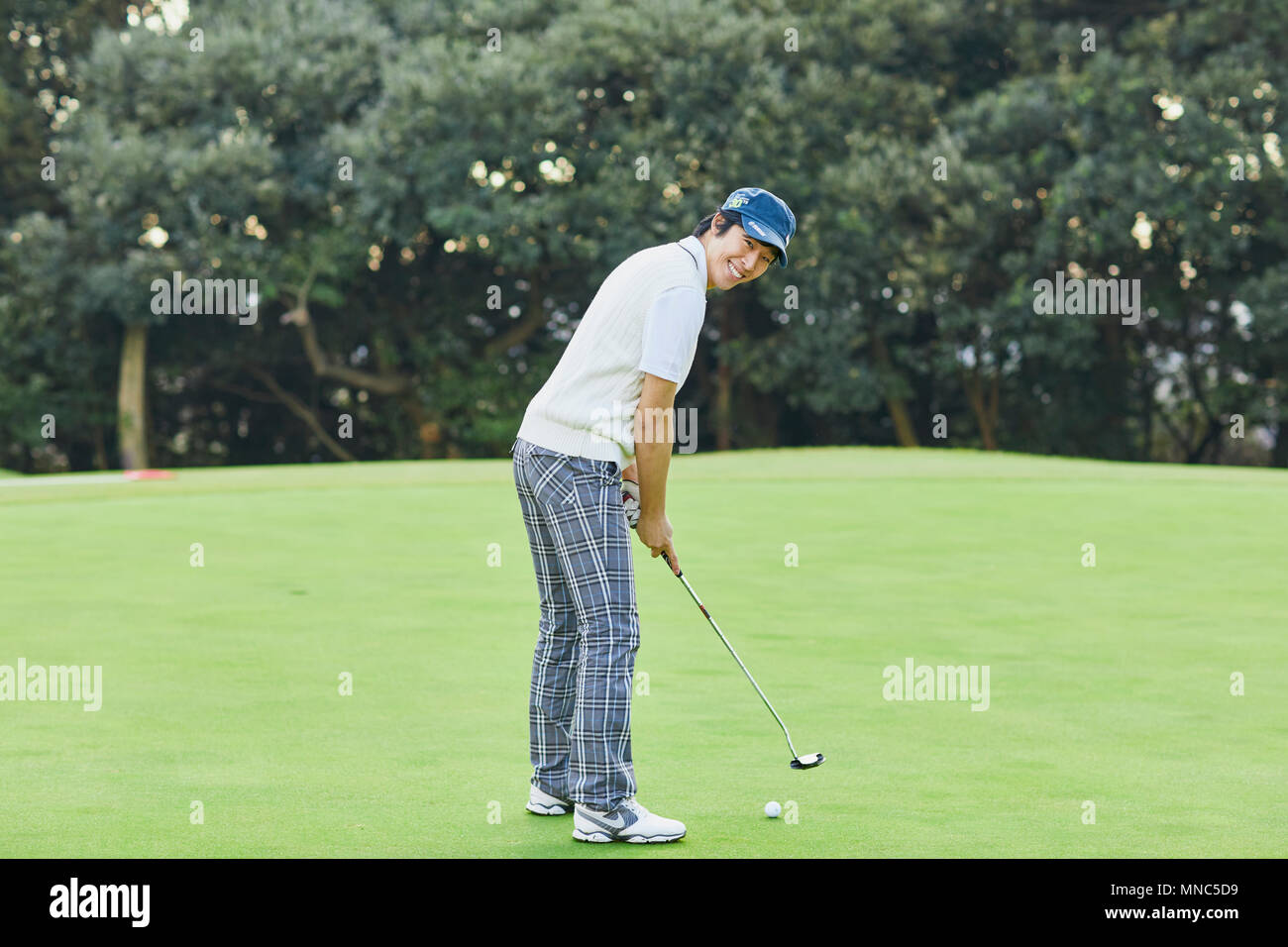 Japanese golf player on course Stock Photo Alamy