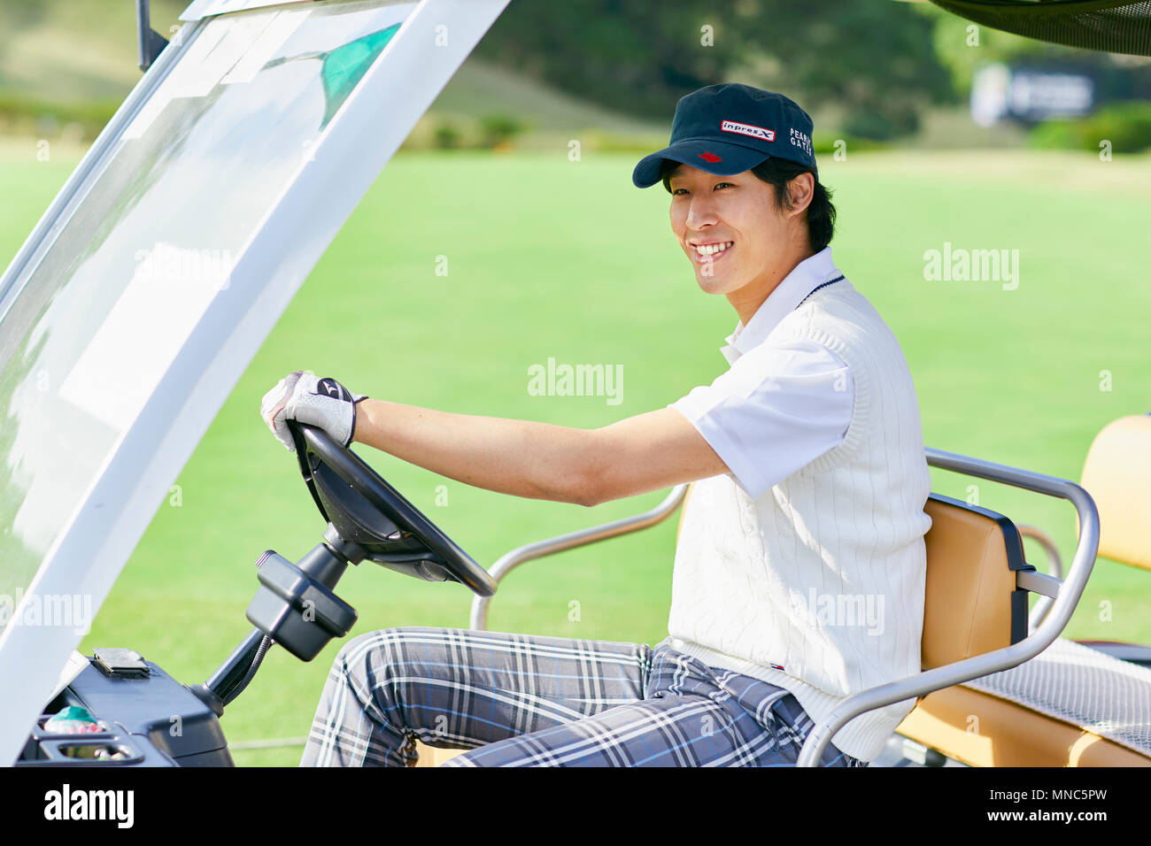 Japanese golf player on course Stock Photo Alamy