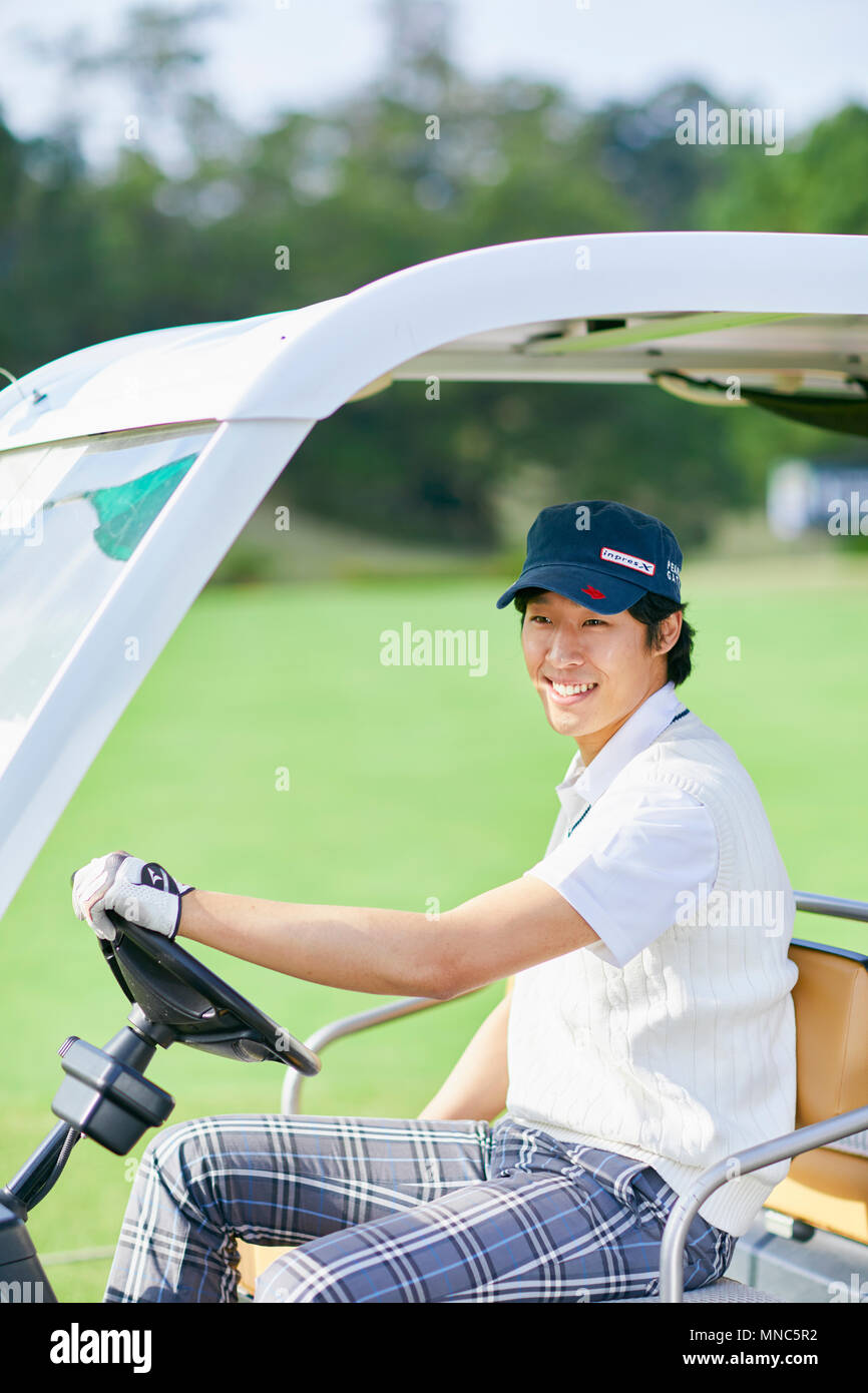 Japanese golf player on course Stock Photo Alamy