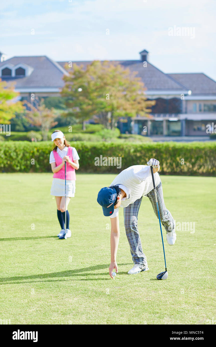 Japanese golf players on course Stock Photo Alamy