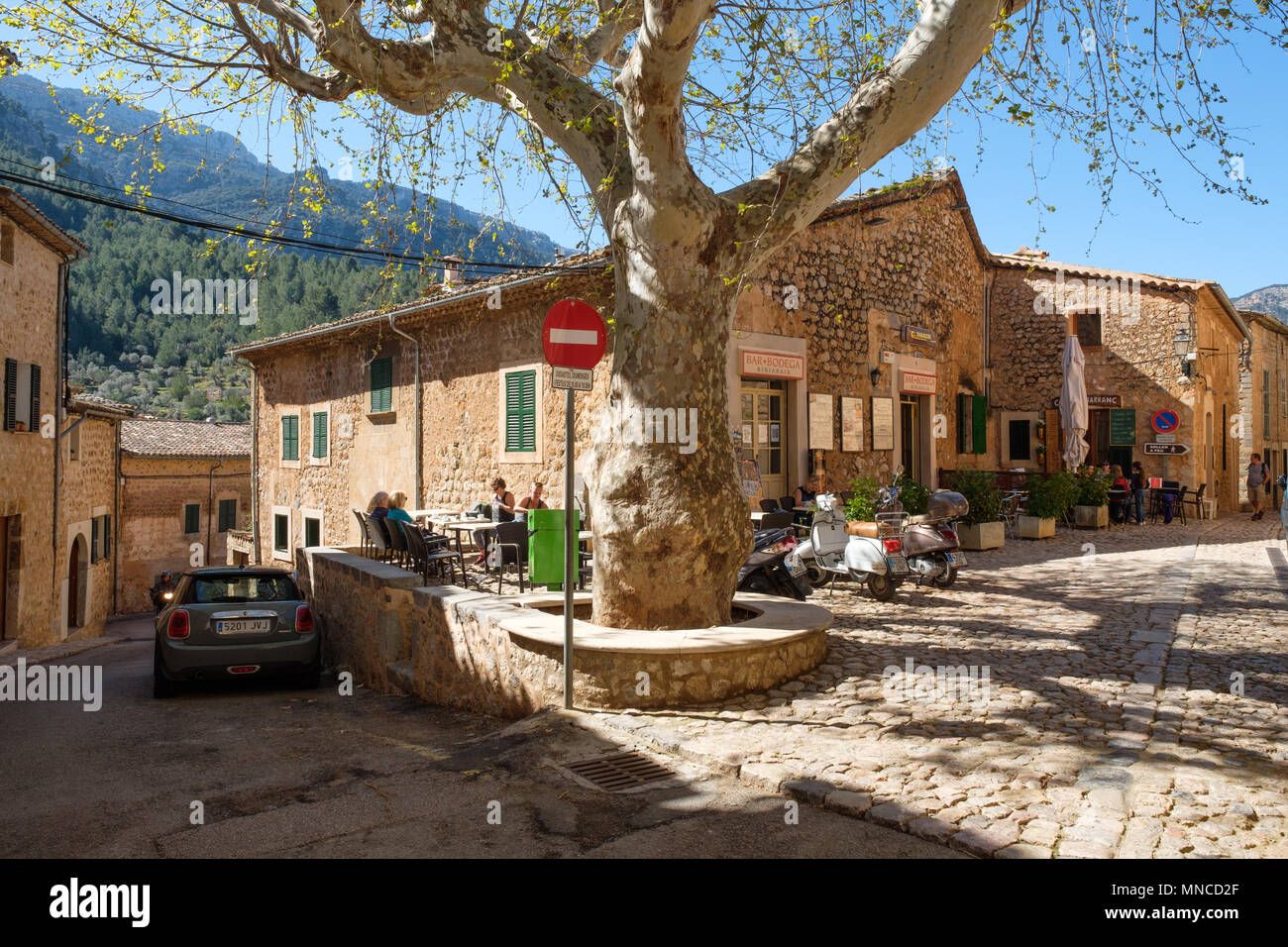 People outside a cafe in the village of Biniaraix, near Soller