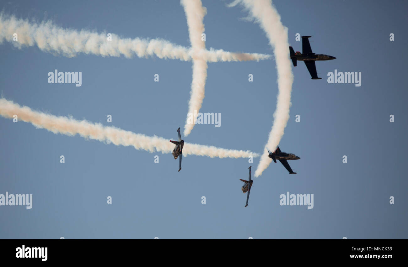 The 2018 Yuma Airshow headliner, The Patriots Jet Team, perform an acrobatic aerial display for spectators during the 2018 Yuma Airshow hosted by Marine Corps Air Station Yuma, Ariz., Saturday, March 17, 2018. The Patriots Jet Team, the largest civilian-owned aerobatic jet team in the western hemisphere, began with the vision of one person: Randy Howell. Fueled by passion for aviation since childhood, it became Howell's mission to create a six-jet precision demonstration team that could entertain, inspire, and educate. The airshow is MCAS Yuma's only military airshow of the year and provides t Stock Photo