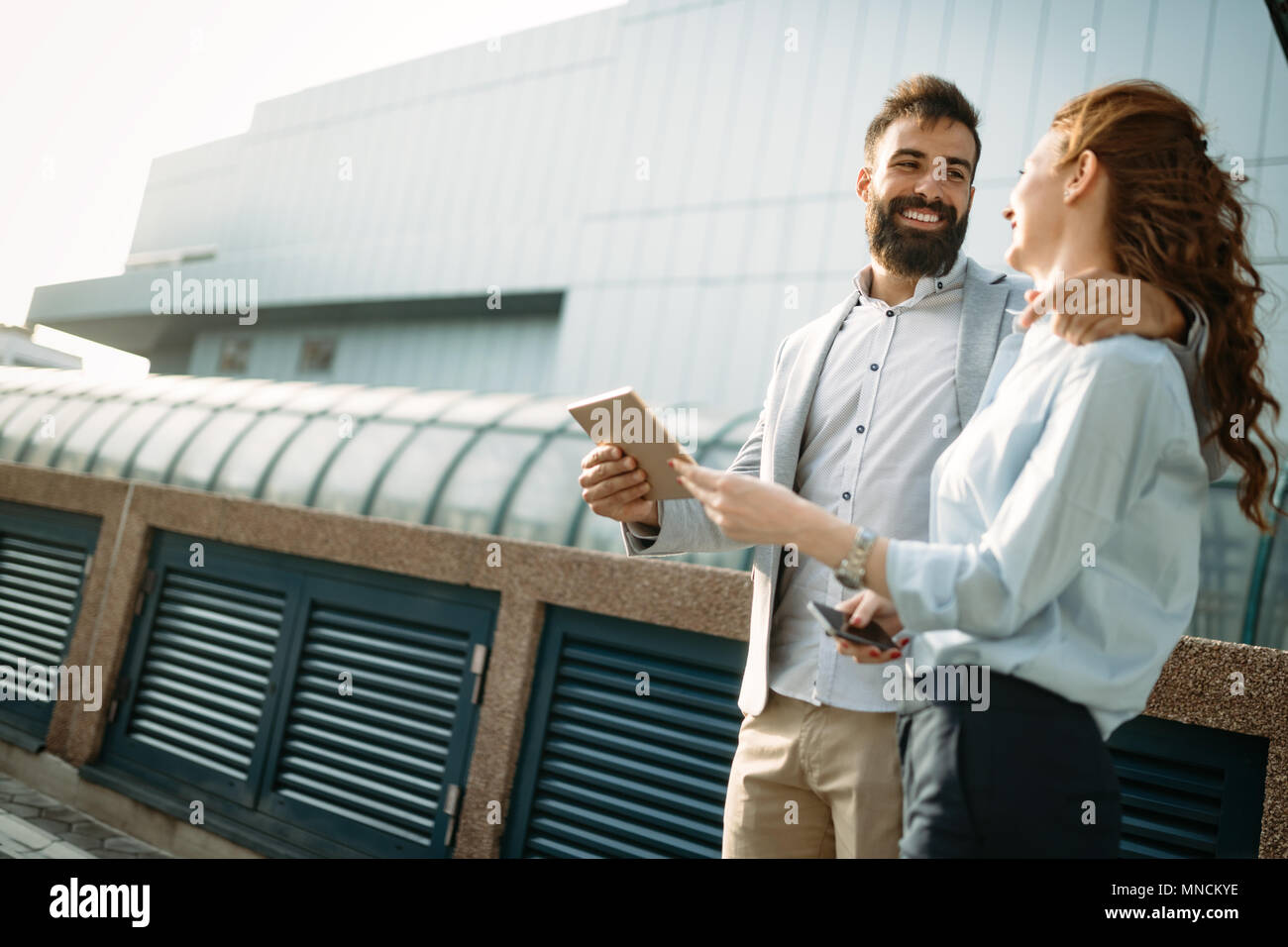 Business people walking and talking outdoor Stock Photo - Alamy