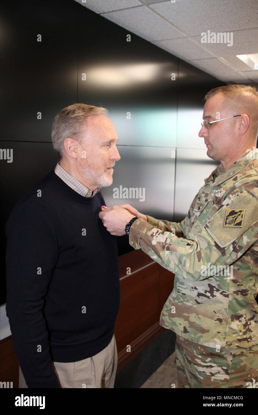 John O. Arntzen (left) received the U.S. Army's 3rd highest award for civilian employees from U.S. Army Corps of Engineers North Atlantic Division (USACE NAD) commander Brig. Gen. William H. Graham (right) at a ceremony conducted at Fort Hamilton, Brooklyn, New York on March 19, 2018.    Arntzen received the Superior Civilian Service Award. The award citation read: For invaluable contributions to the USACE Military Construction Program, while serving as a Senior Program Manager, North Atlantic Division, Military Integration Division (MID) from November 2004 to April 2018.  John successfully ex Stock Photo