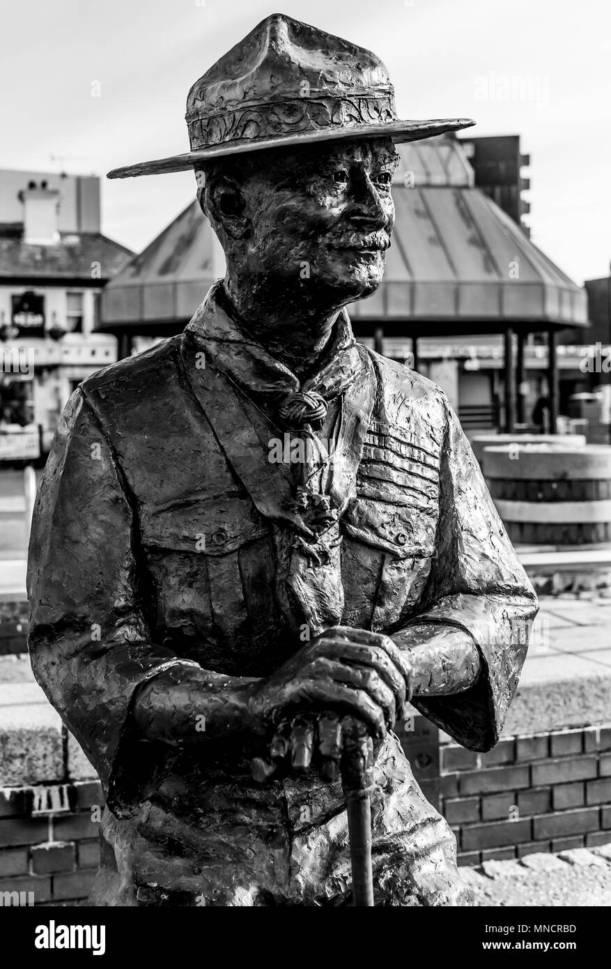 Statue and memorial to Robert Baden Powell on the quayside of Poole harbour who established the Boy Scout movement Stock Photo