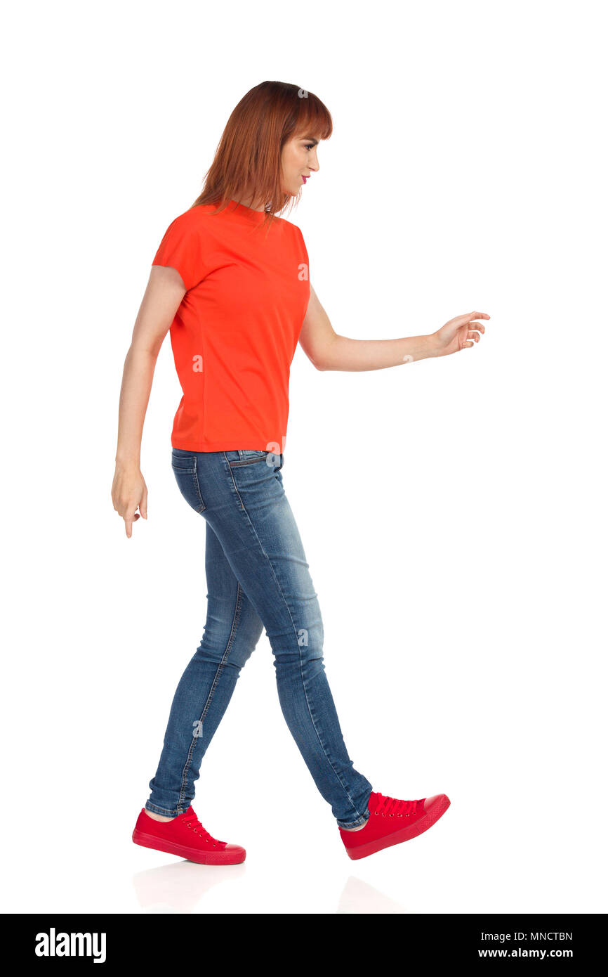 Full Length Body Size Side Profile Photo Jumping High Beautiful She Her  Lady Hands Arms Up Win Game Play Match Wearing Casual Jeans Denim White  Tshirt Clothes Isolated Yellow Bright Vivid Background