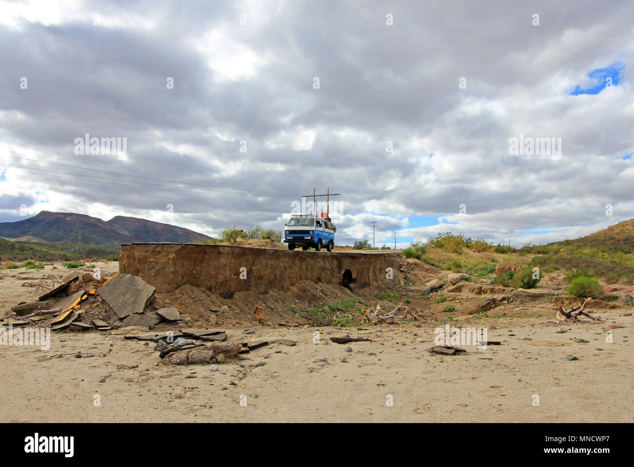 Old Vintage Van On Damaged And Washed Out Road In Baja California