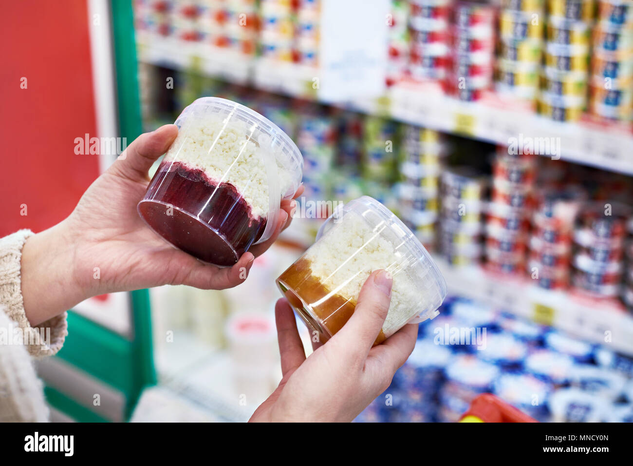 Buyer Hands With Plastic Container Of Cottage Cheese With Jam In