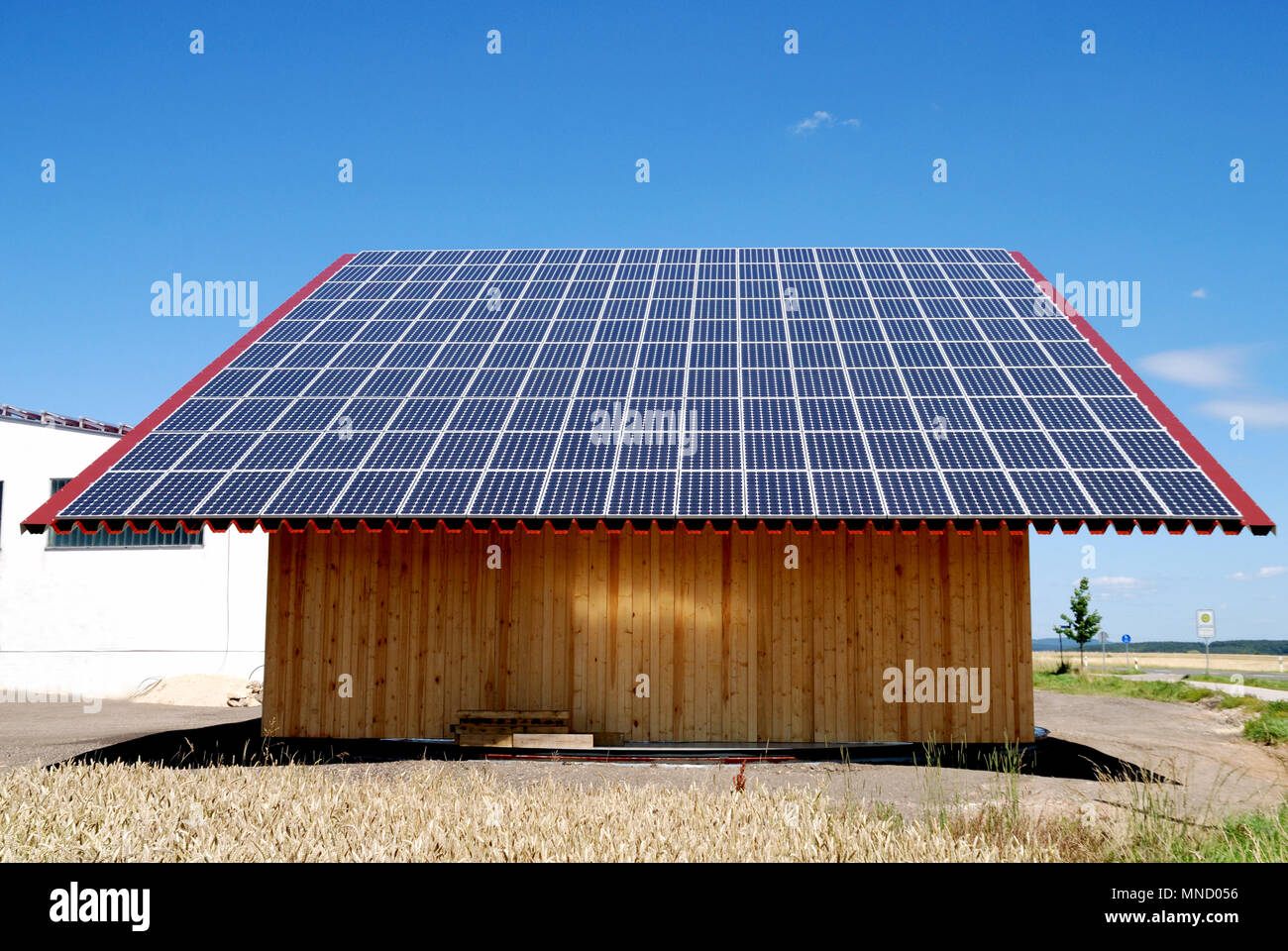 A farmer in Germany is using the whole roof of his barn to get energy for his house with solar power. Stock Photo