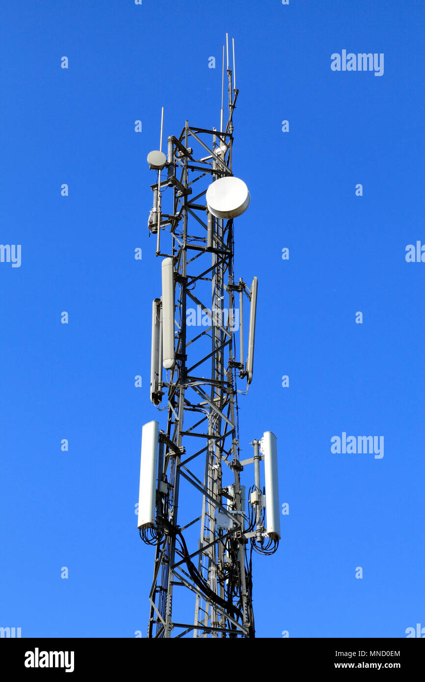 Communications mast, tower, signals, satellite dish, radio, Hunstanton Police Station, Norfolk, England, UK Stock Photo