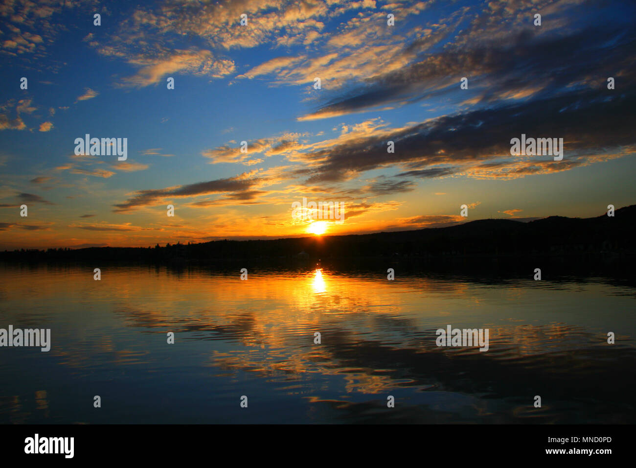 A very beautiful moments. The sky is reflecting on the water. Double sunset, magneficient. Stock Photo