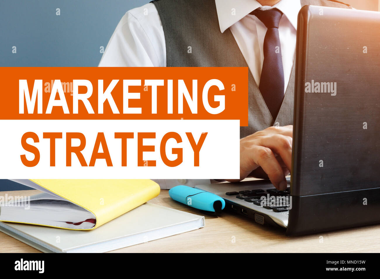 Marketing Strategy concept. Marketer working on a laptop. Stock Photo