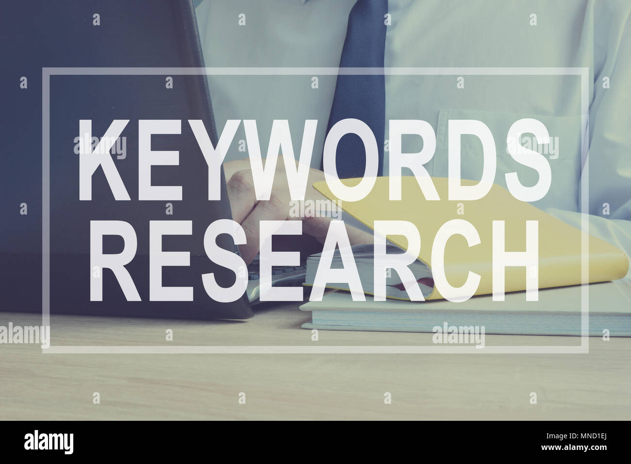 Keywords Research for SEO concept. Man is typing. Stock Photo