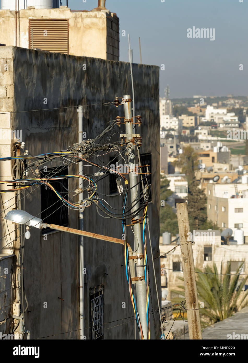 Creative laying of aboveground electrical cables in Madaba, jordan