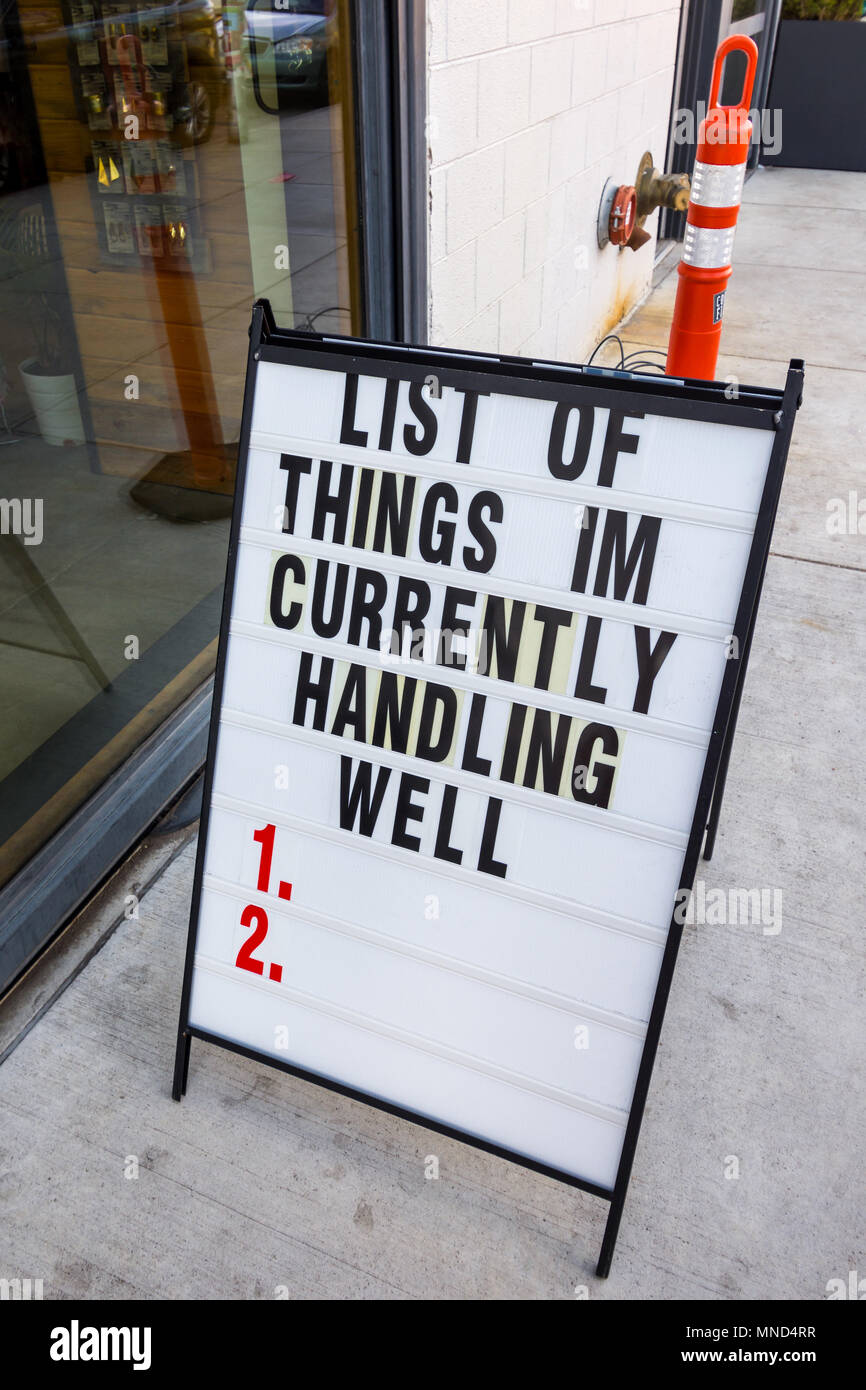 Optimistic / pessimistic sign on street, Denver, Colorado, USA. Stock Photo