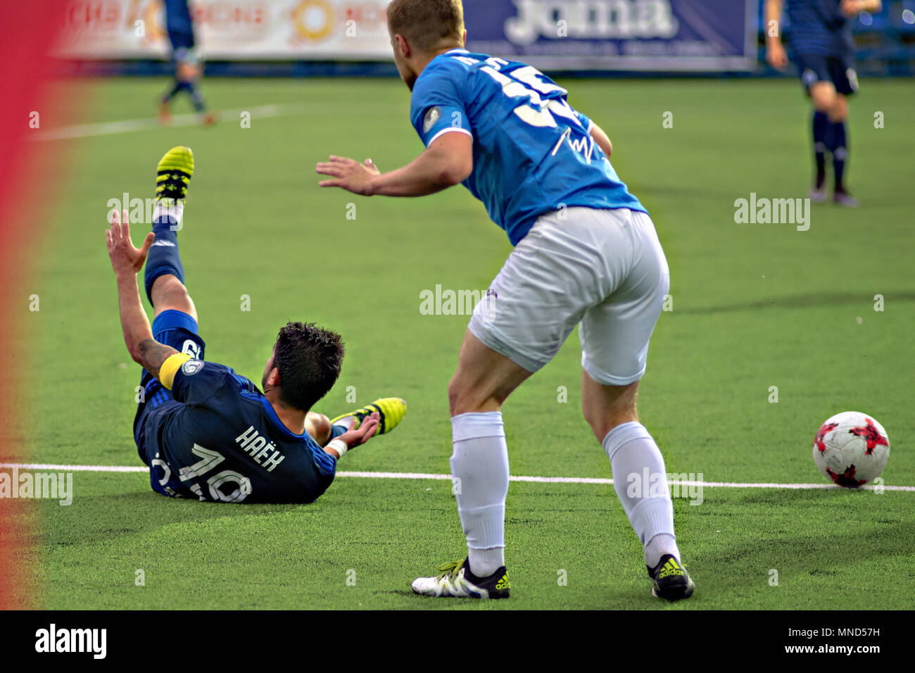 MINSK, BELARUS - MAY 14, 2018: Soccer players fights for ball during the Belarusian Premier League football match between FC Dynamo Minsk and FC Luch at the Olimpiyskiy stadium. Stock Photo