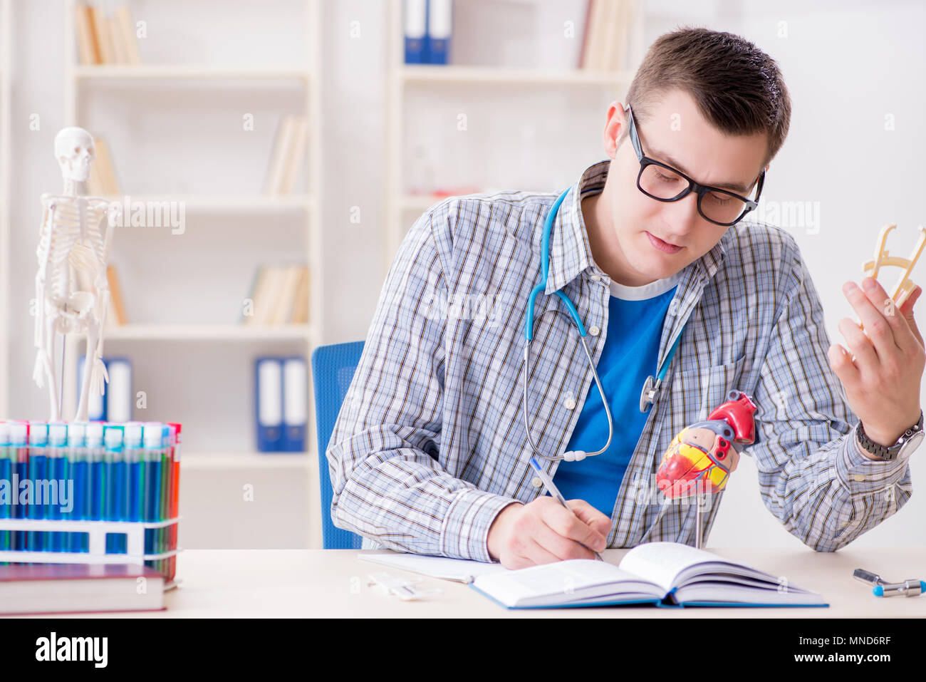 Medical student studying heart in classroom during lecture Stock Photo ...