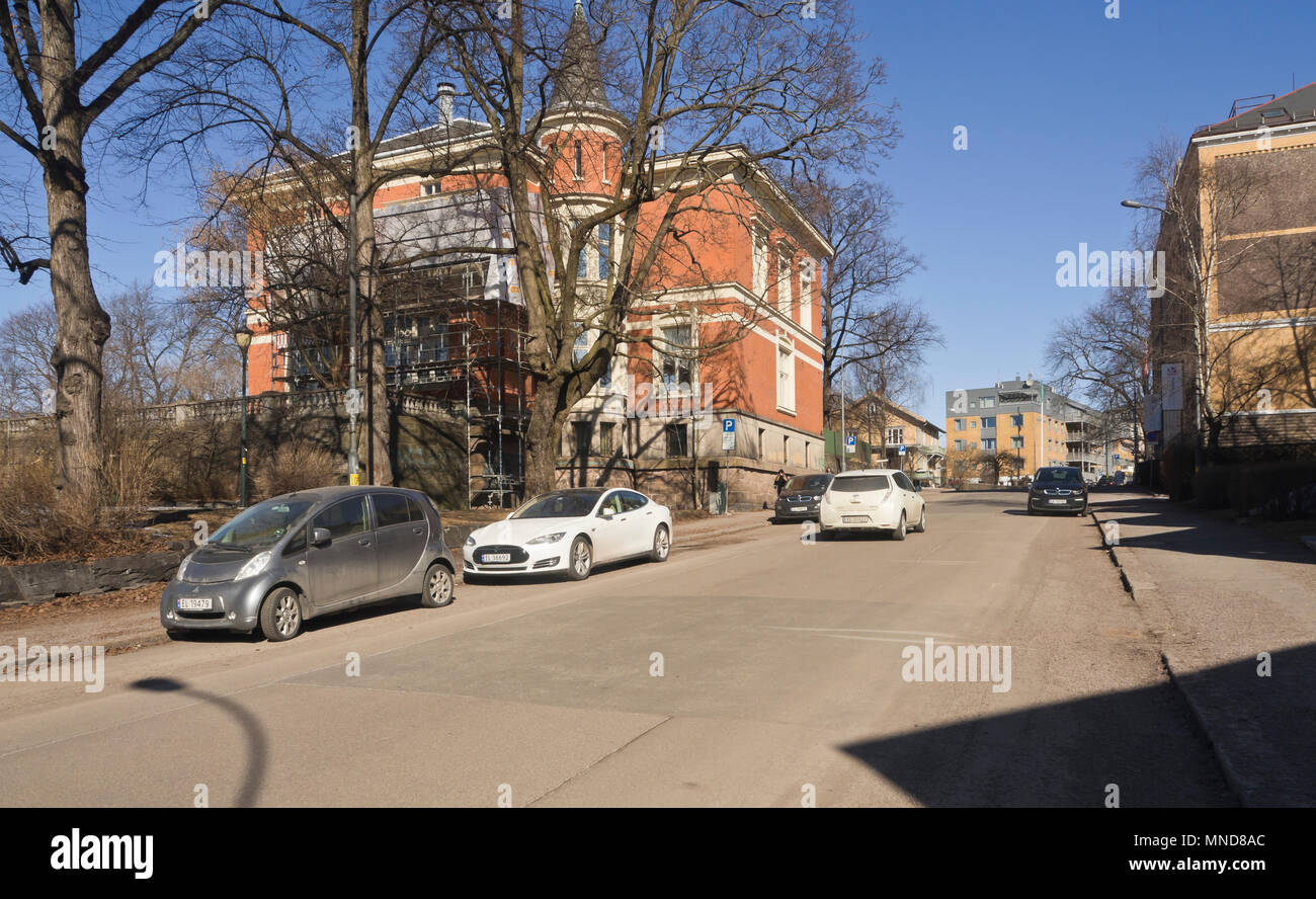 Electric vehicles (recognizable by their EL and EK registration marks) have taken over this residential street in the Frogner area of Oslo Norway Stock Photo