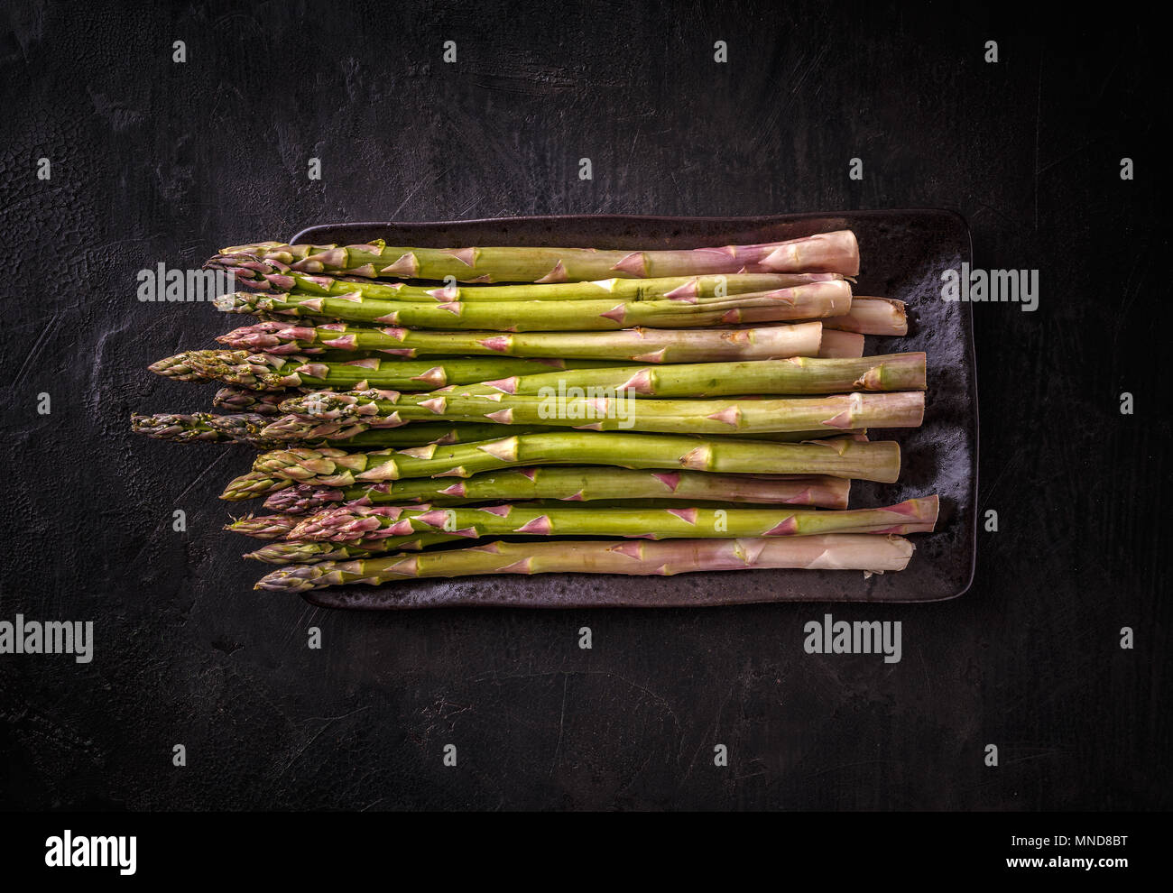 Fresh green asparagus on a black background Stock Photo
