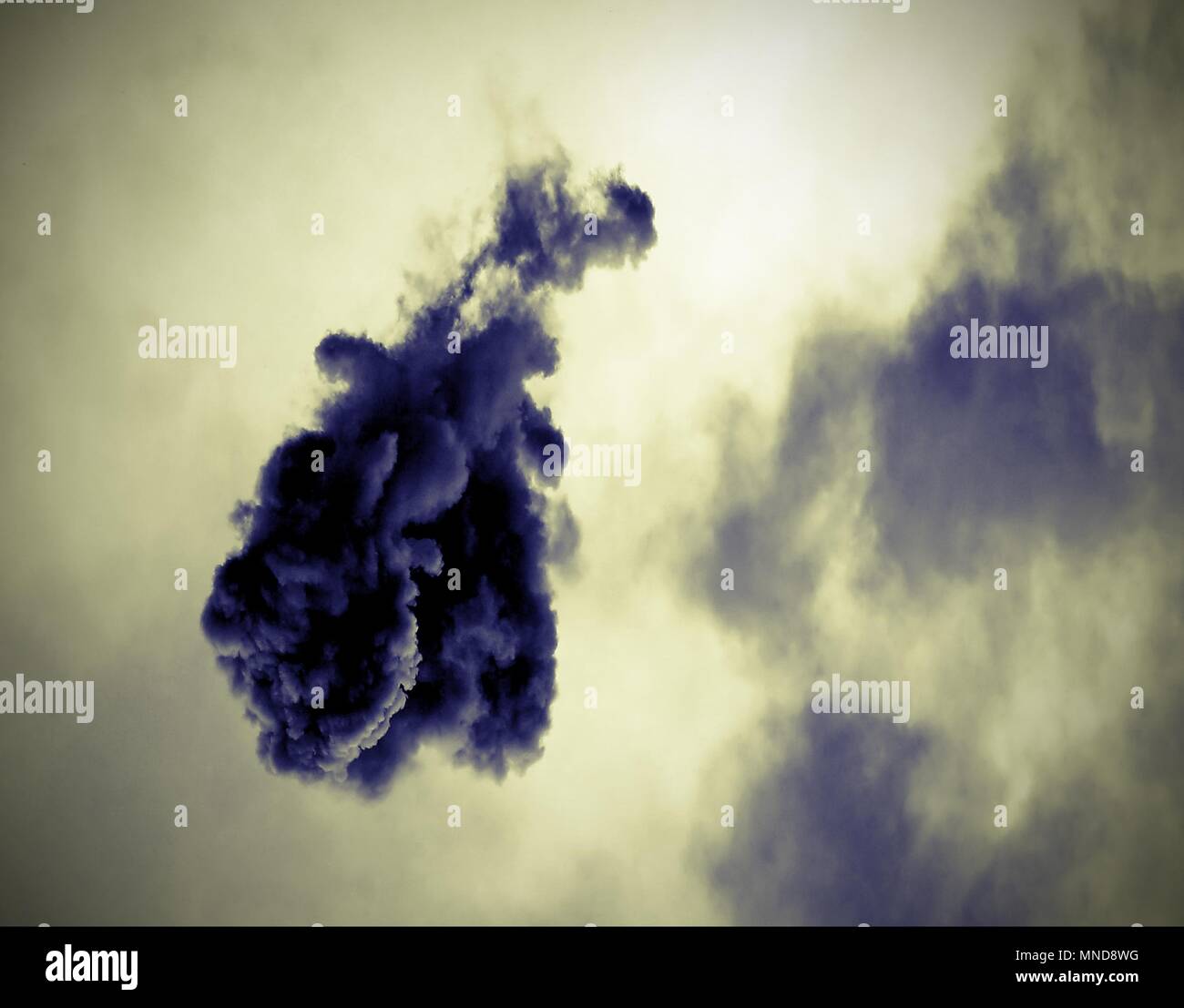 black cloud after the explosion of the rocket in the sky with vintage old effect Stock Photo