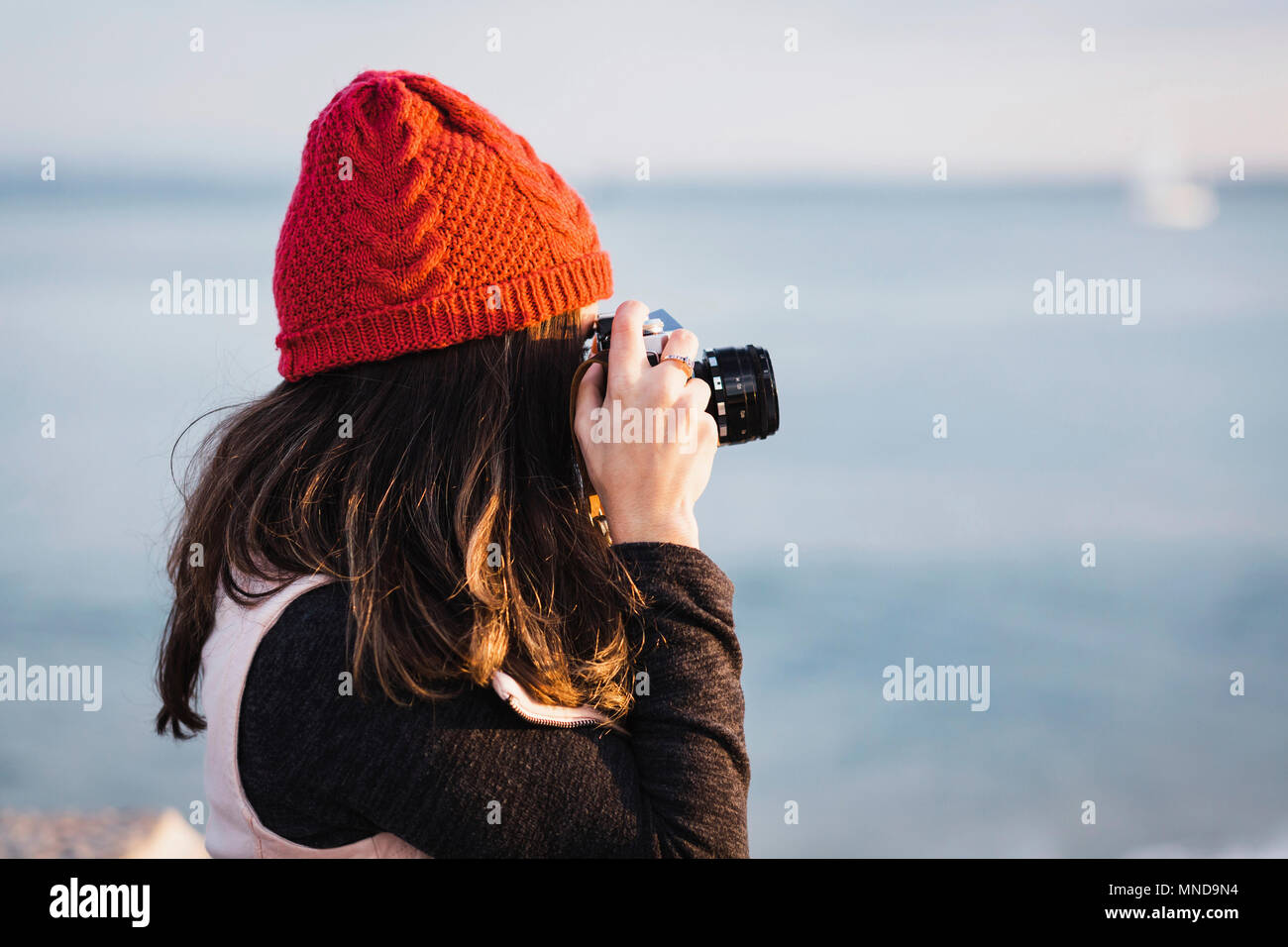 Woman photographing the sea hi-res stock photography and images - Alamy