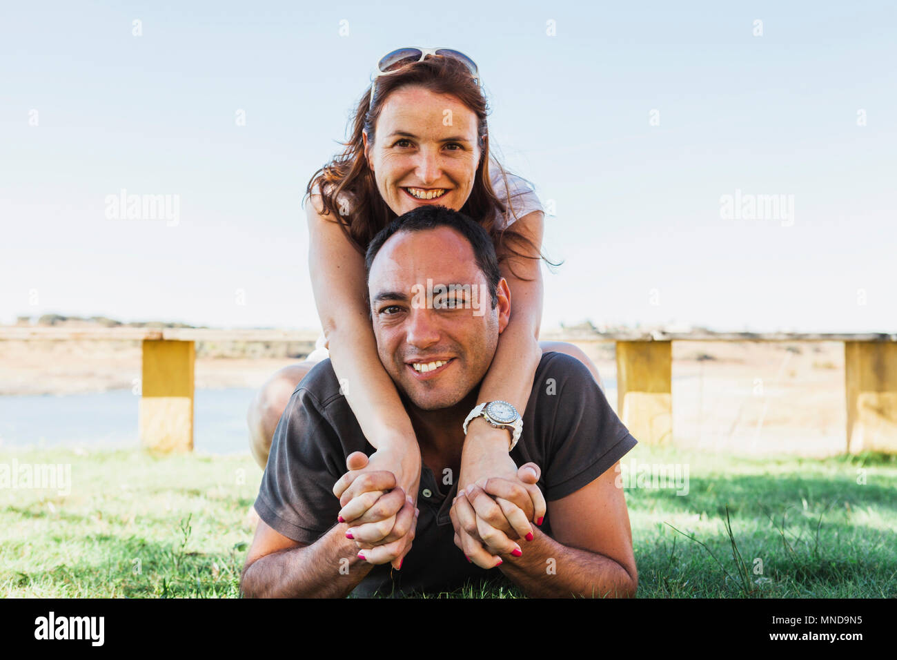 Mature couple lying grass hi-res stock photography and images - Alamy