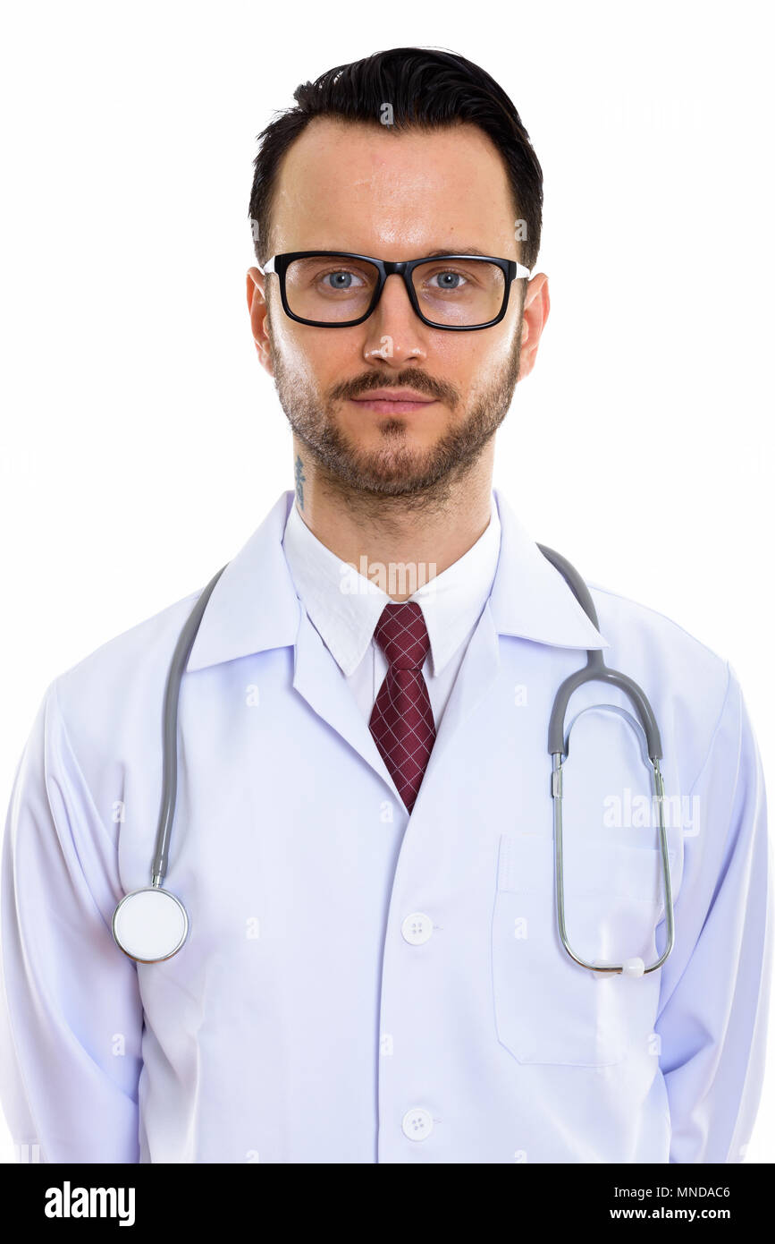 Studio shot of young man doctor wearing eyeglasses Stock Photo - Alamy