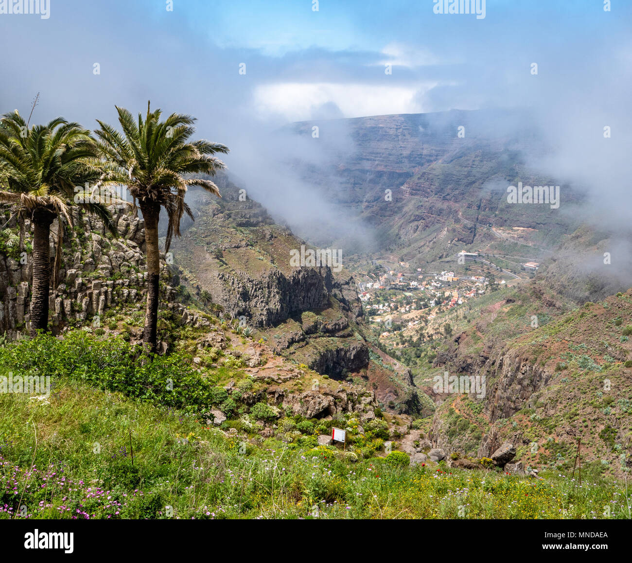 Looking down the Barranco del Agua towards the villages of Valle Gran Rey far below on the island of La Gomera in the Canary Islands Stock Photo
