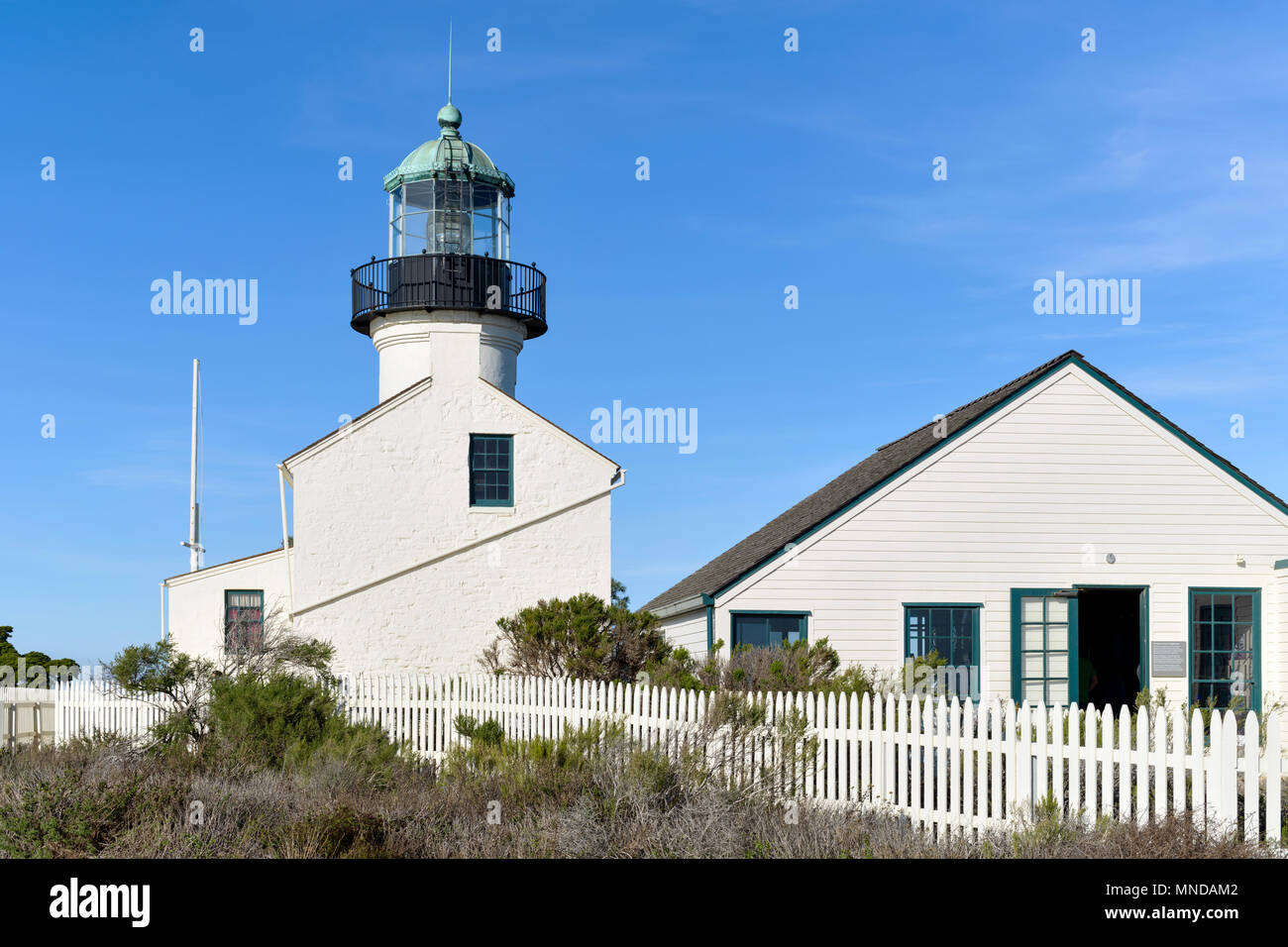 Point Loma Lighthouse - A full view of over-century-old Old Point Loma Lighthouse and outbuilding in Cabrillo National Monument, San Diego, CA, USA. Stock Photo