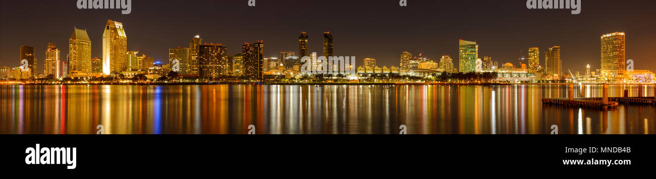 San Diego at Night - A panoramic night view of waterfront skyline of San Diego Downtown at San Diego Bay, looking from Coronado Peninsula, CA, USA. Stock Photo