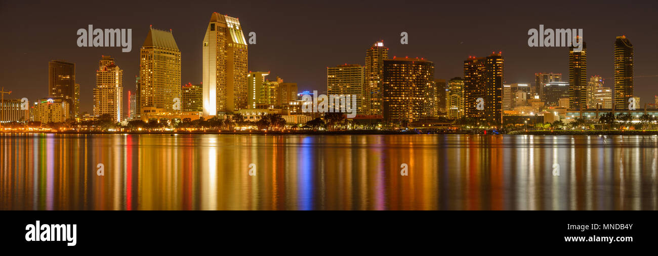 San Diego at Night - A panoramic night view of waterfront skyline of San Diego Downtown at San Diego Bay, looking from Coronado Peninsula, CA, USA. Stock Photo