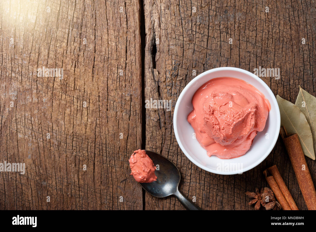 Red lime paste or red limestone paste. Red lime paste is food-grade lime  powder mixed with turmeric and ofen used in Thai food Stock Photo - Alamy