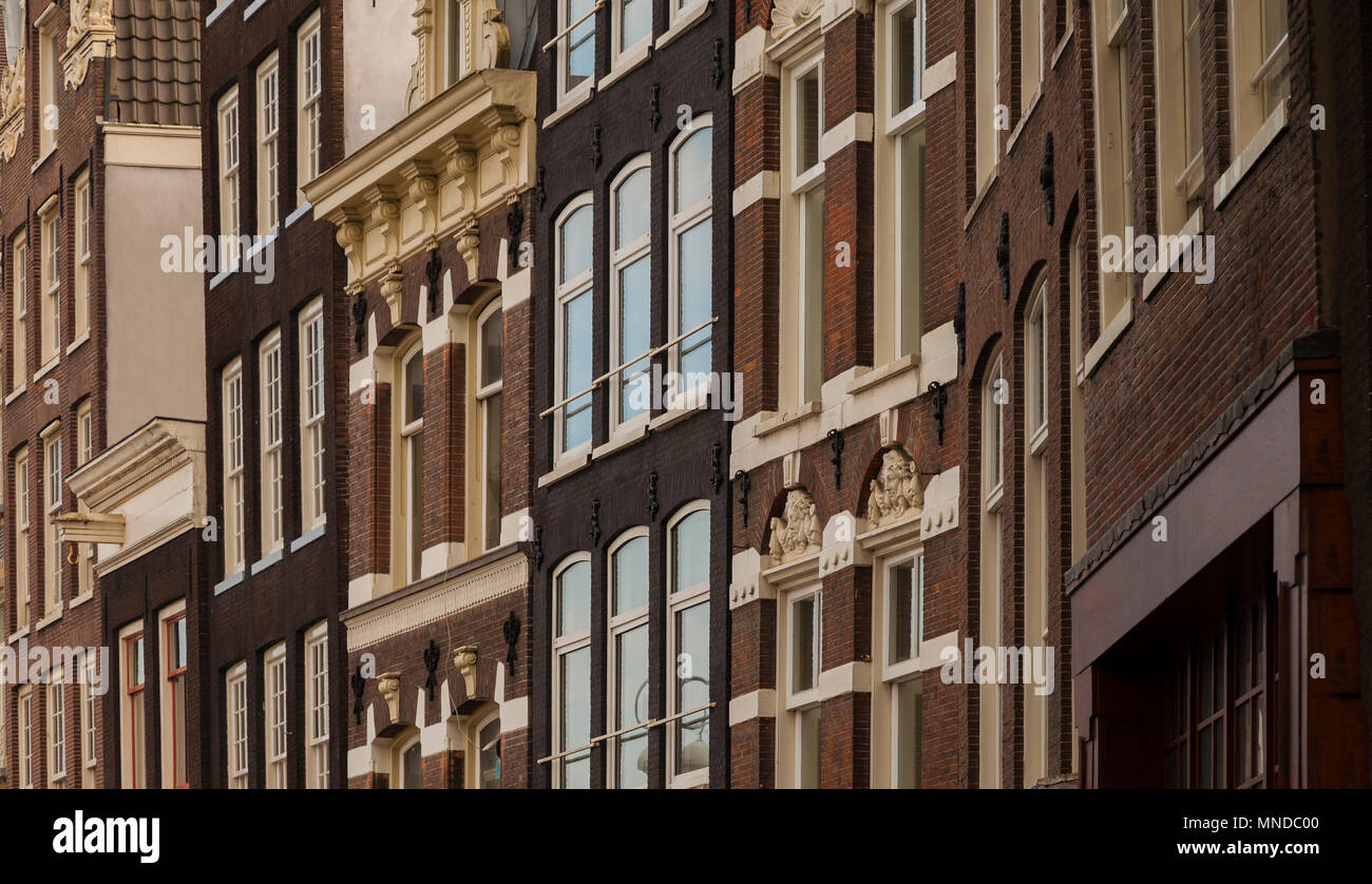 Typical architecture of dutch buildings front in Amsterdam Stock Photo