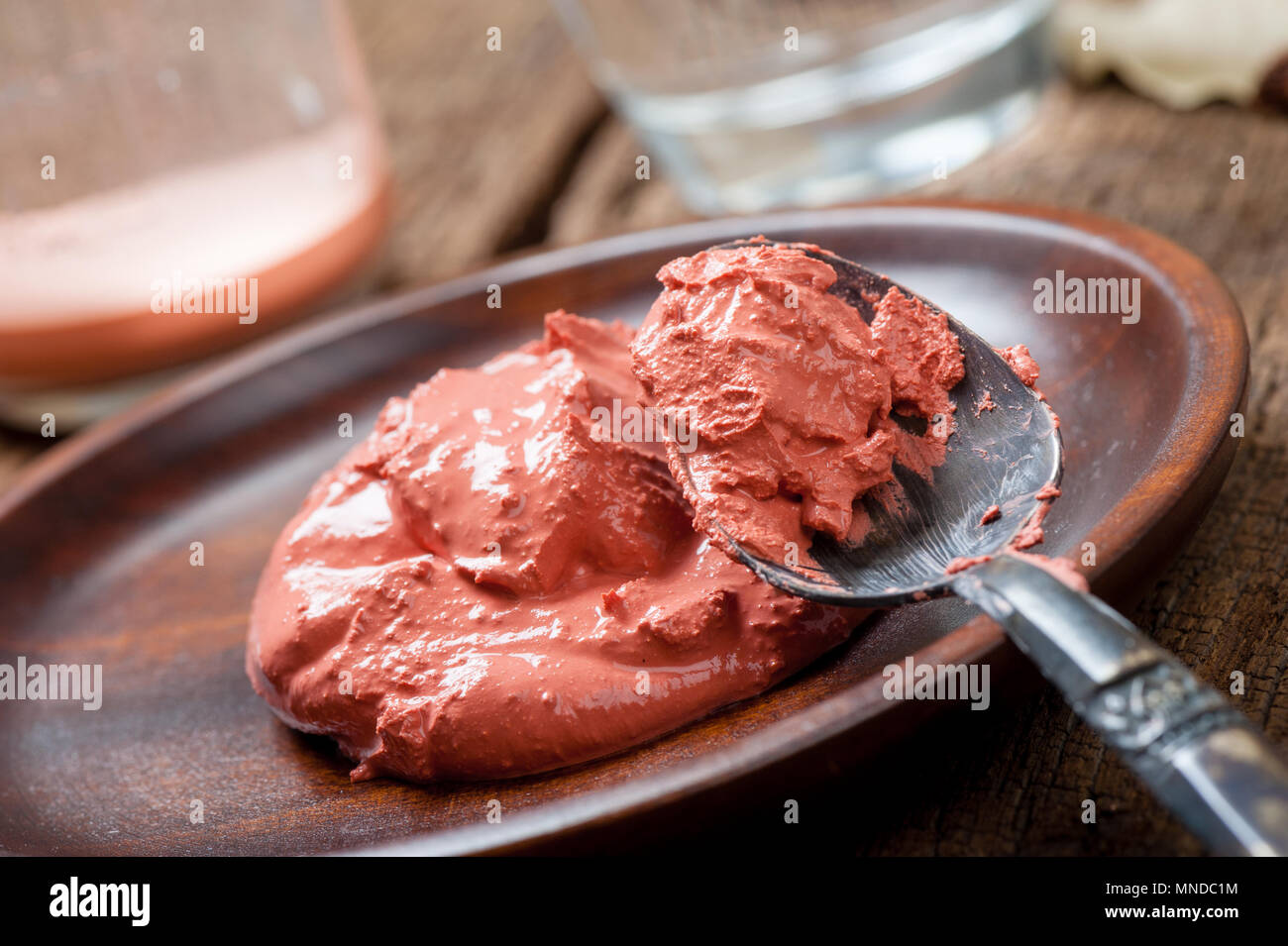 Red lime paste or red limestone paste. Red lime paste is foodgrade