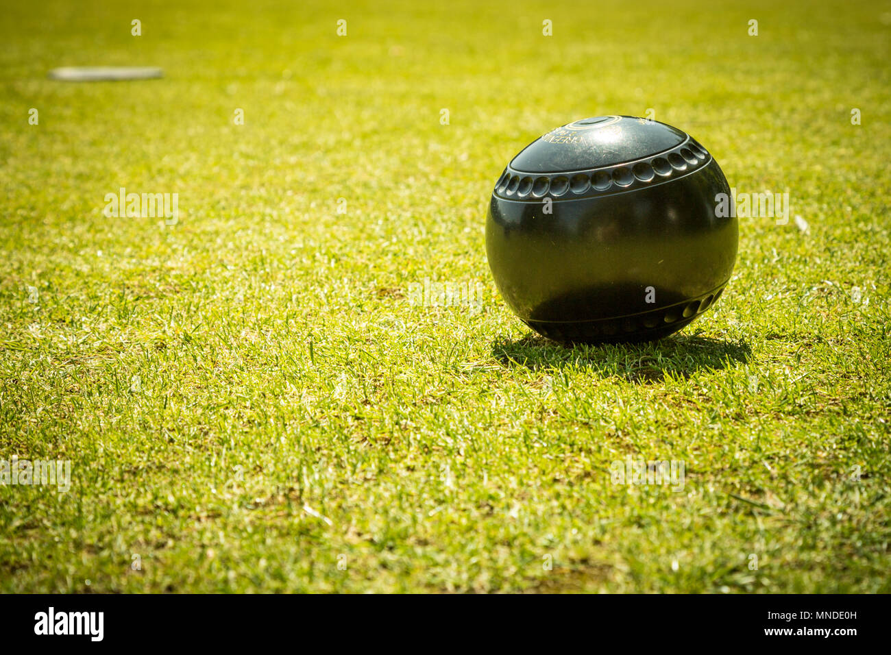 Bowls bowling ball on green, UK Stock Photo Alamy