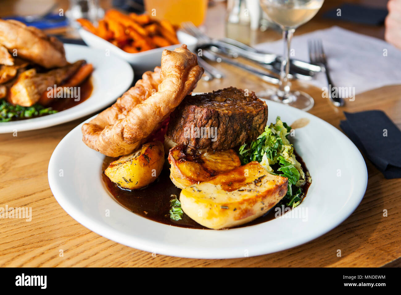 Vegetarian dinner with nut roast, potatoes, yorkshire pudding and gravy