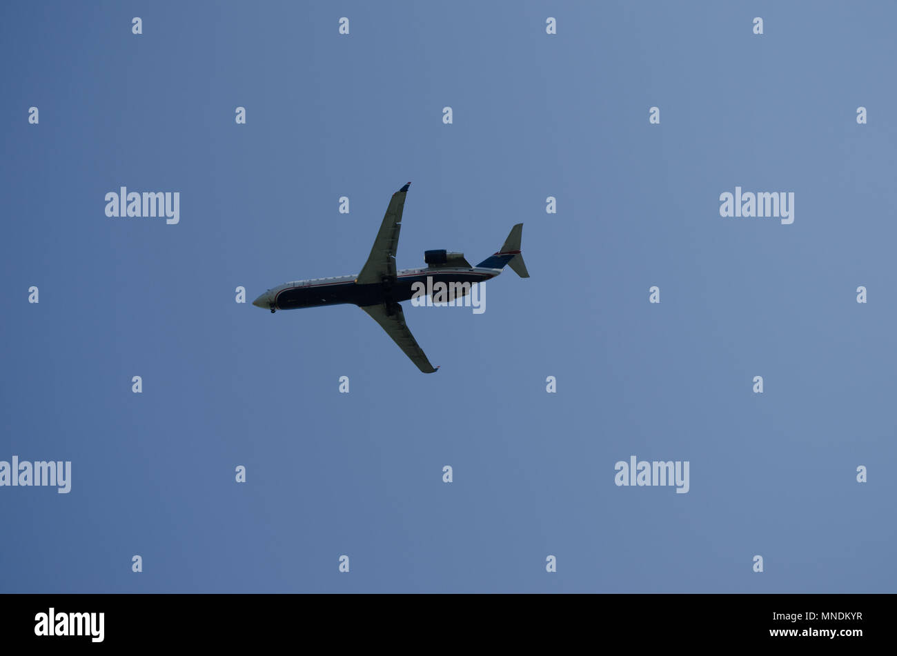 airplane flying with blue sky background Stock Photo - Alamy