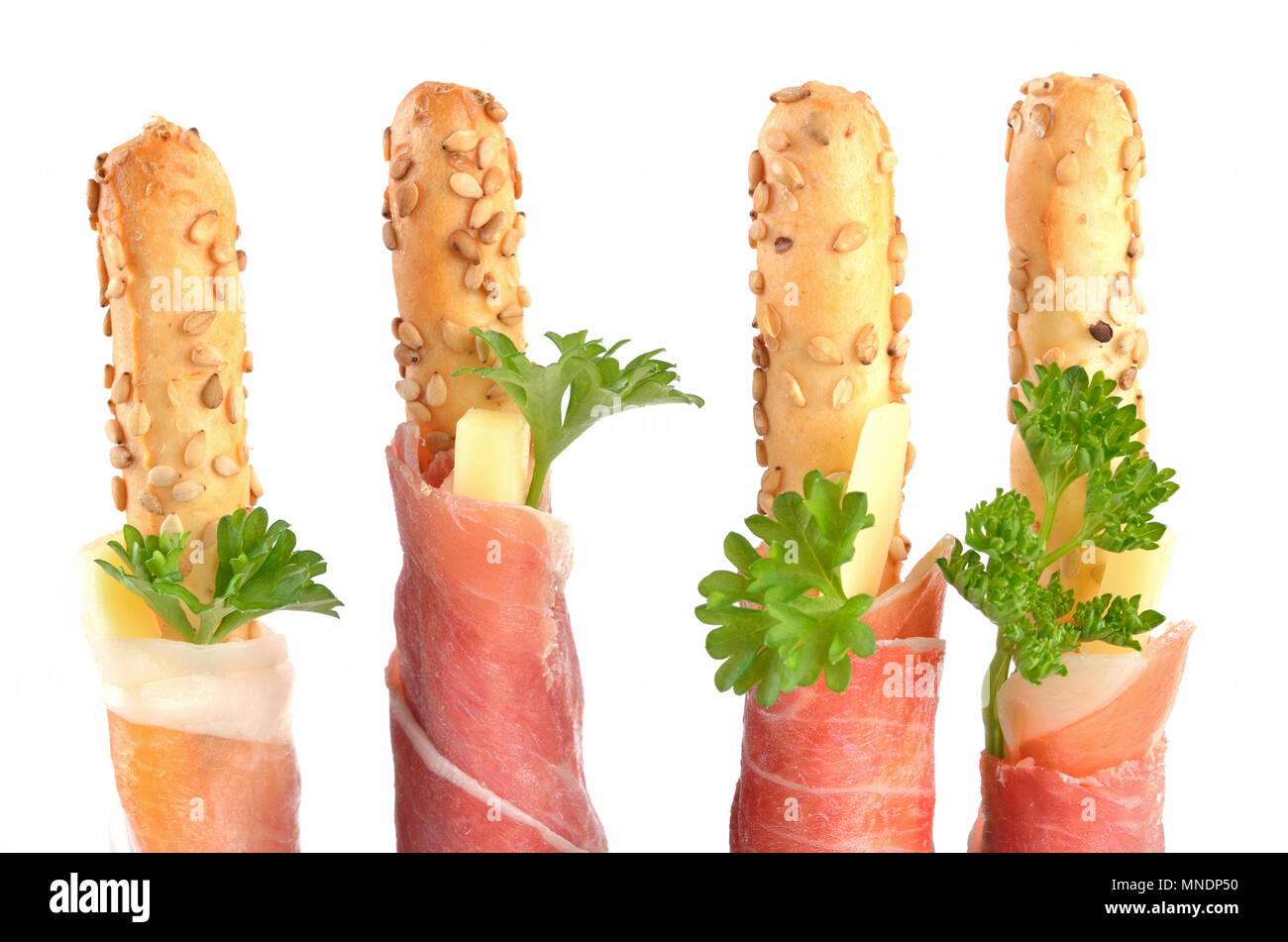 Grissini with cheese sticks wrapped with Italian Parma ham Stock Photo