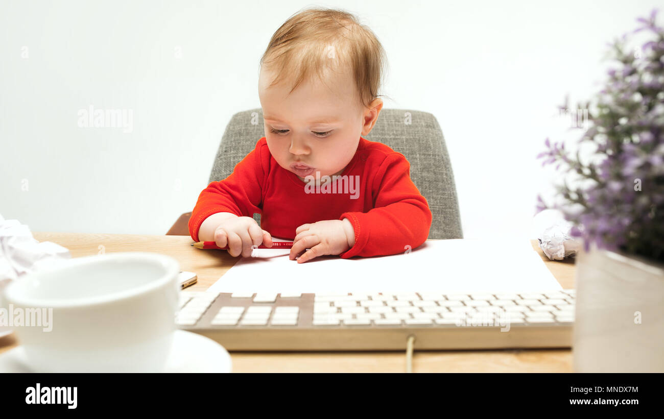 Happy child baby girl toddler sitting with keyboard of computer ...