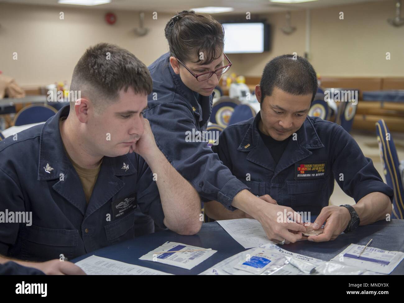 180514-N-MD713-0042 PACIFIC OCEAN (May 14, 2018) U.S. and Japanese Sailors learn about wound assessments and proper wound dressing techniques during a skin and wound care course aboard Military Sealift Command hospital ship USNS Mercy (T-AH 19) in support of upcoming Pacific Partnership 2018 (PP18) missions, May 14, 2018. PP18's mission is to work collectively with host and partner nations to enhance regional interoperability and disaster response capabilities, increase stability and security in the region, and foster new and enduring friendships across the Indo-Pacific Region. Pacific Partner Stock Photo